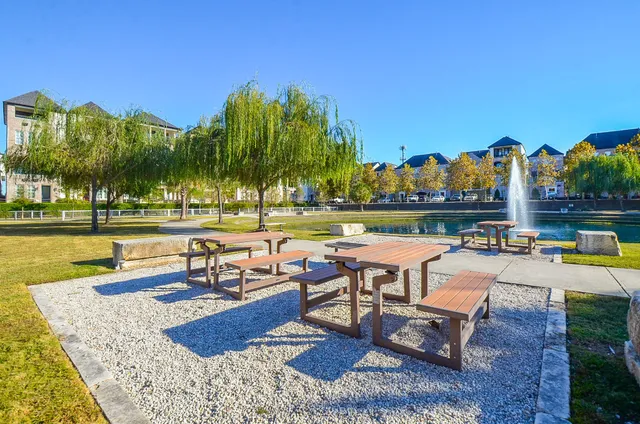 a swimming pool with outdoor seating and yard