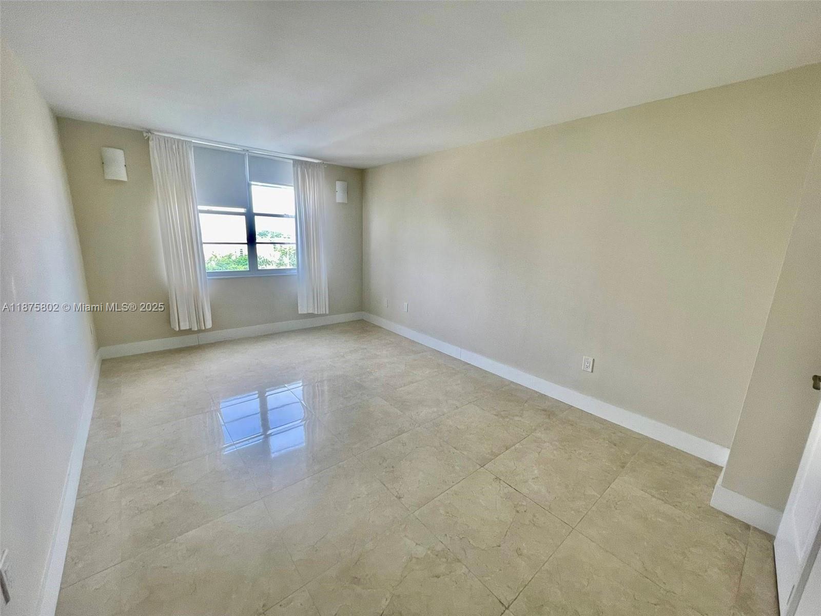 2851 Northeast 183rd Street, Unit 802E Aventura, FL 33160 - Photo 11 of 37 an empty room with windows