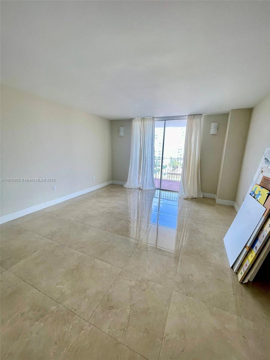 2851 Northeast 183rd Street, Unit 802E Aventura, FL 33160 - Photo 13 of 37 an empty room with windows