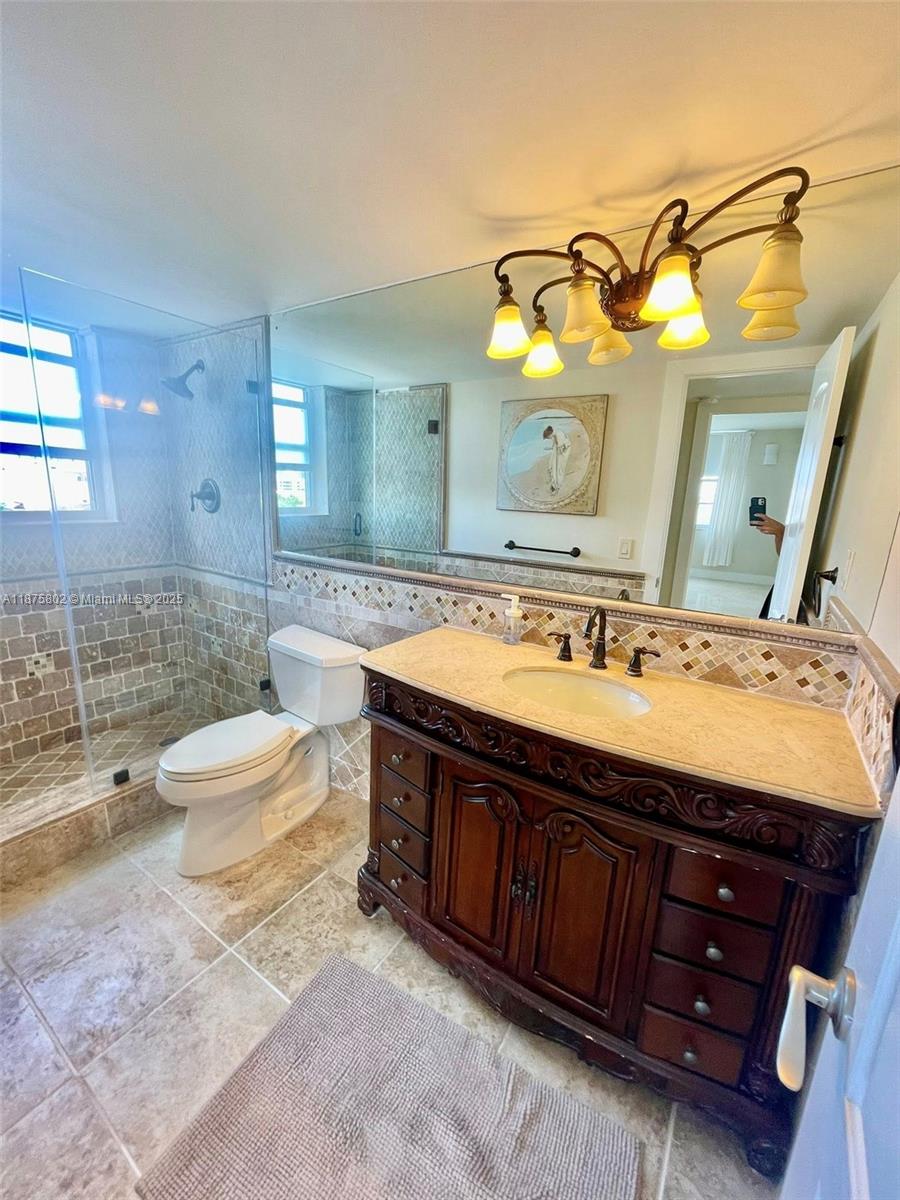 2851 Northeast 183rd Street, Unit 802E Aventura, FL 33160 - Photo 17 of 37 a spacious bathroom with a double vanity sink and a mirror