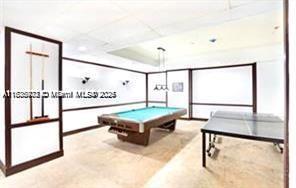 2851 Northeast 183rd Street, Unit 802E Aventura, FL 33160 - Photo 20 of 37 a living room with table tennis air table and stairs