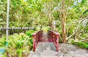 2851 Northeast 183rd Street, Unit 802E Aventura, FL 33160 - Photo 21 of 37 a view of a pathway in a garden