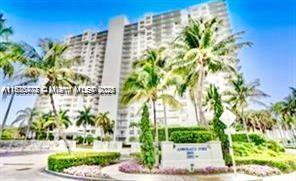 2851 Northeast 183rd Street, Unit 802E Aventura, FL 33160 - Photo 24 of 37 a front view of a multi story building with yard