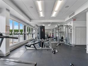 2851 Northeast 183rd Street, Unit 802E Aventura, FL 33160 - Photo 30 of 37 a view of a room with gym equipment