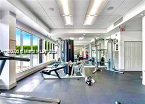 2851 Northeast 183rd Street, Unit 802E Aventura, FL 33160 - Photo 34 of 37 a view of a room with gym equipment