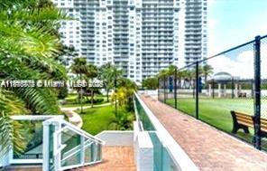 2851 Northeast 183rd Street, Unit 802E Aventura, FL 33160 - Photo 35 of 37 a view of a swimming pool with a patio