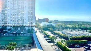 2851 Northeast 183rd Street, Unit 802E Aventura, FL 33160 - Photo 37 of 37 a view of a garden with a building in the background
