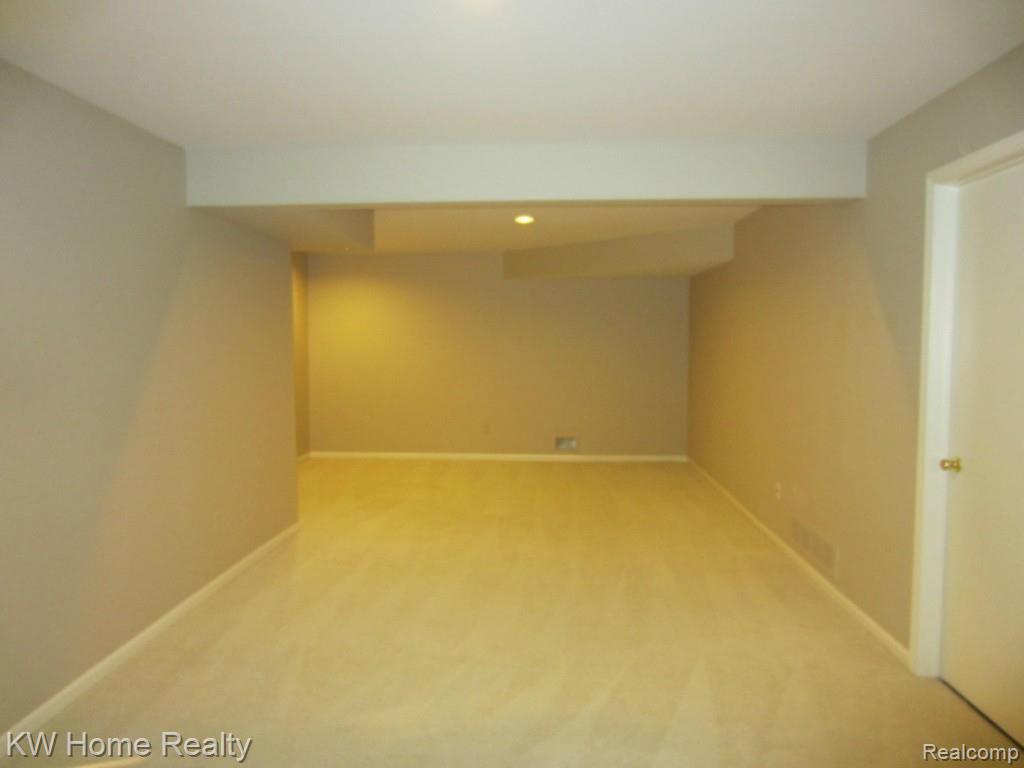 2210 London Bridge Drive, Unit 7 Rochester, MI 48307 - Photo 16 of 21 LONDON-FAMILY ROOM-LOWER LEVEL.jpg