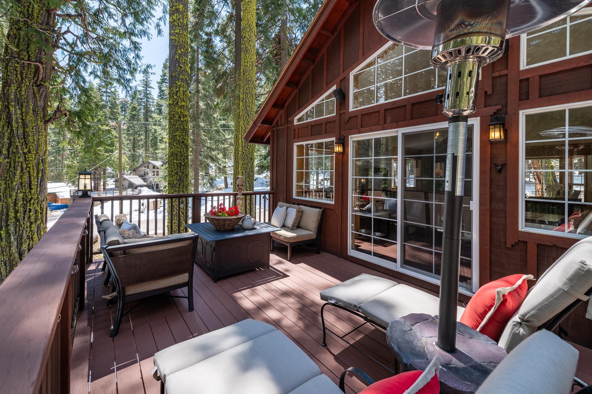 790 Sugar Pine Road Homewood, CA 96141 - Photo 17 of 21 a view of a patio with couches table and chairs and potted plants