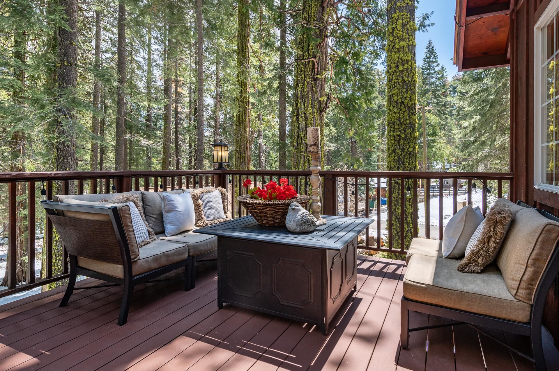 790 Sugar Pine Road Homewood, CA 96141 - Photo 19 of 21 a roof deck with couches and wooden floor