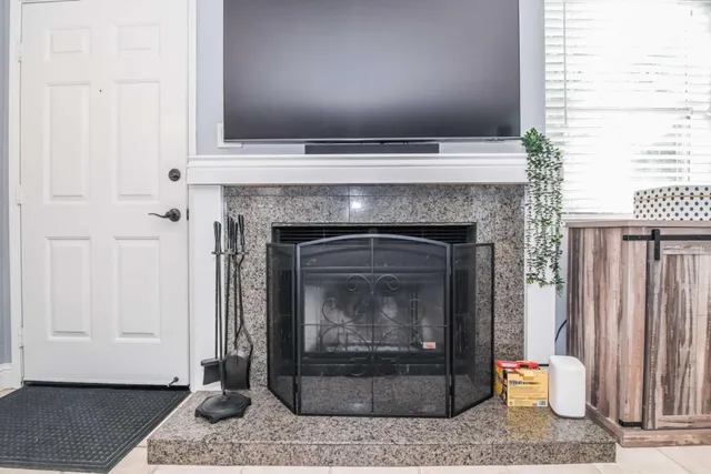a bathroom with a granite countertop toilet sink and mirror
