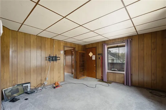 a view of an empty room with closet