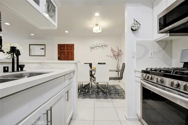 a view of a hallway with wooden floor and a fireplace