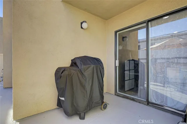 a roof deck with table and chairs