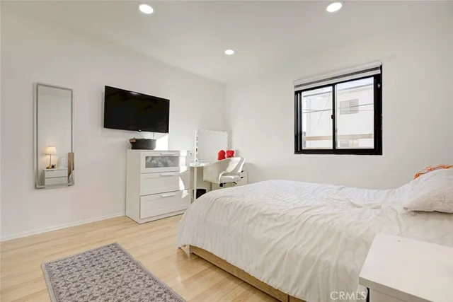 a bedroom with a bed and a table