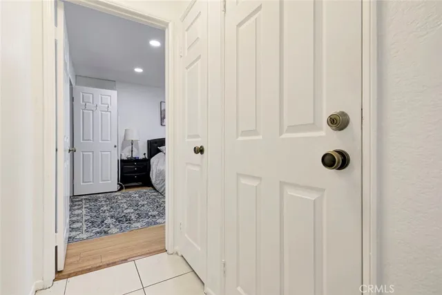 a bedroom with a bed and flat screen tv