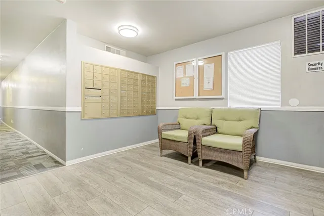 a view of a swimming pool with lawn chairs