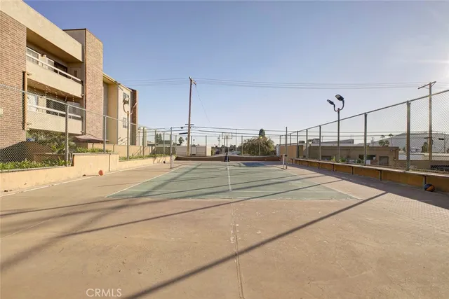 a view of a patio with a table and chairs