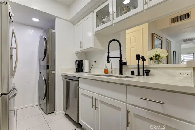 a kitchen with stainless steel appliances kitchen island a stove and a refrigerator