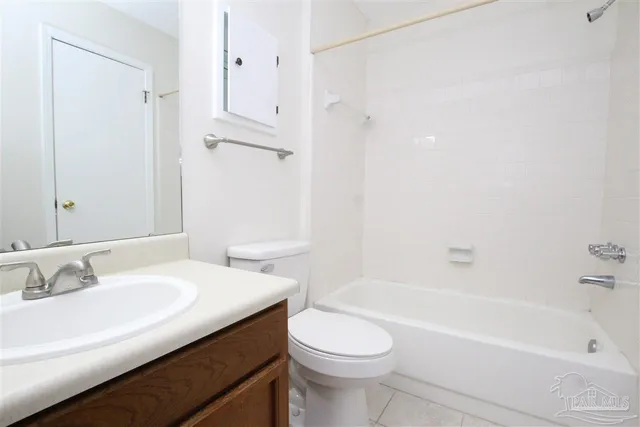 a bathroom with a sink a toilet and a bathtub