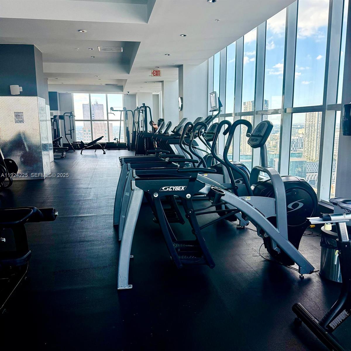 133 Northeast 2nd Avenue, Unit 208 Miami, FL 33132 - Photo 20 of 22 a view of a room with gym equipment