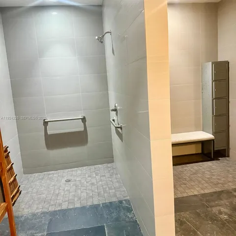 a bathroom with a shower and a toilet