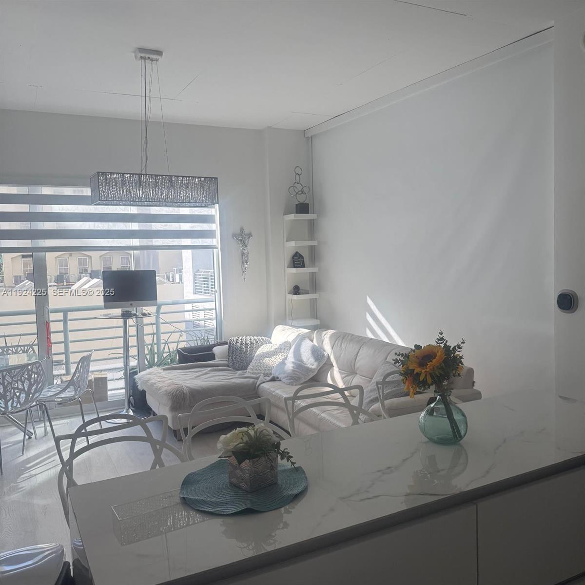 133 Northeast 2nd Avenue, Unit 208 Miami, FL 33132 - Photo 8 of 22 a living room with furniture