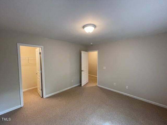 8203 Saltwood Place Raleigh, NC 27617 - Photo 11 of 24 an empty room with windows