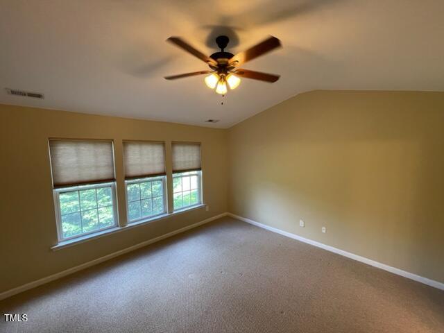 8203 Saltwood Place Raleigh, NC 27617 - Photo 13 of 24 an empty room with windows and ceiling fan