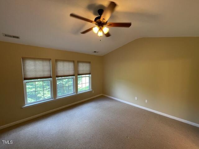 8203 Saltwood Place Raleigh, NC 27617 - Photo 15 of 24 an empty room with a window and a ceiling fan