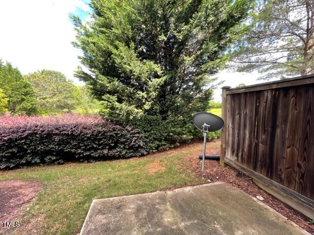 8203 Saltwood Place Raleigh, NC 27617 - Photo 23 of 24 a view of a backyard with green space