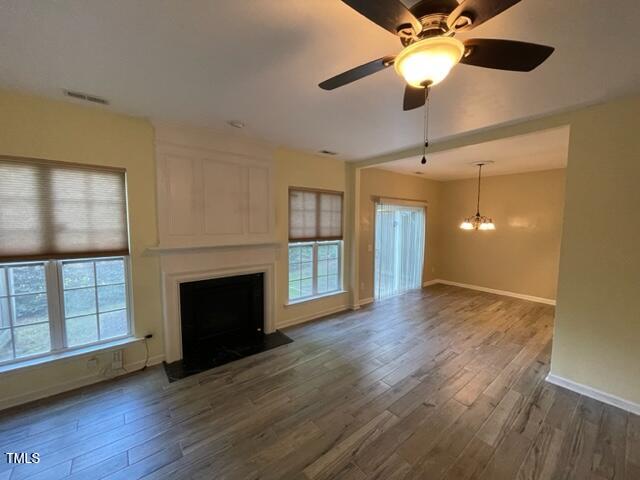 8203 Saltwood Place Raleigh, NC 27617 - Photo 5 of 24 a view of an empty room with a fireplace and a window