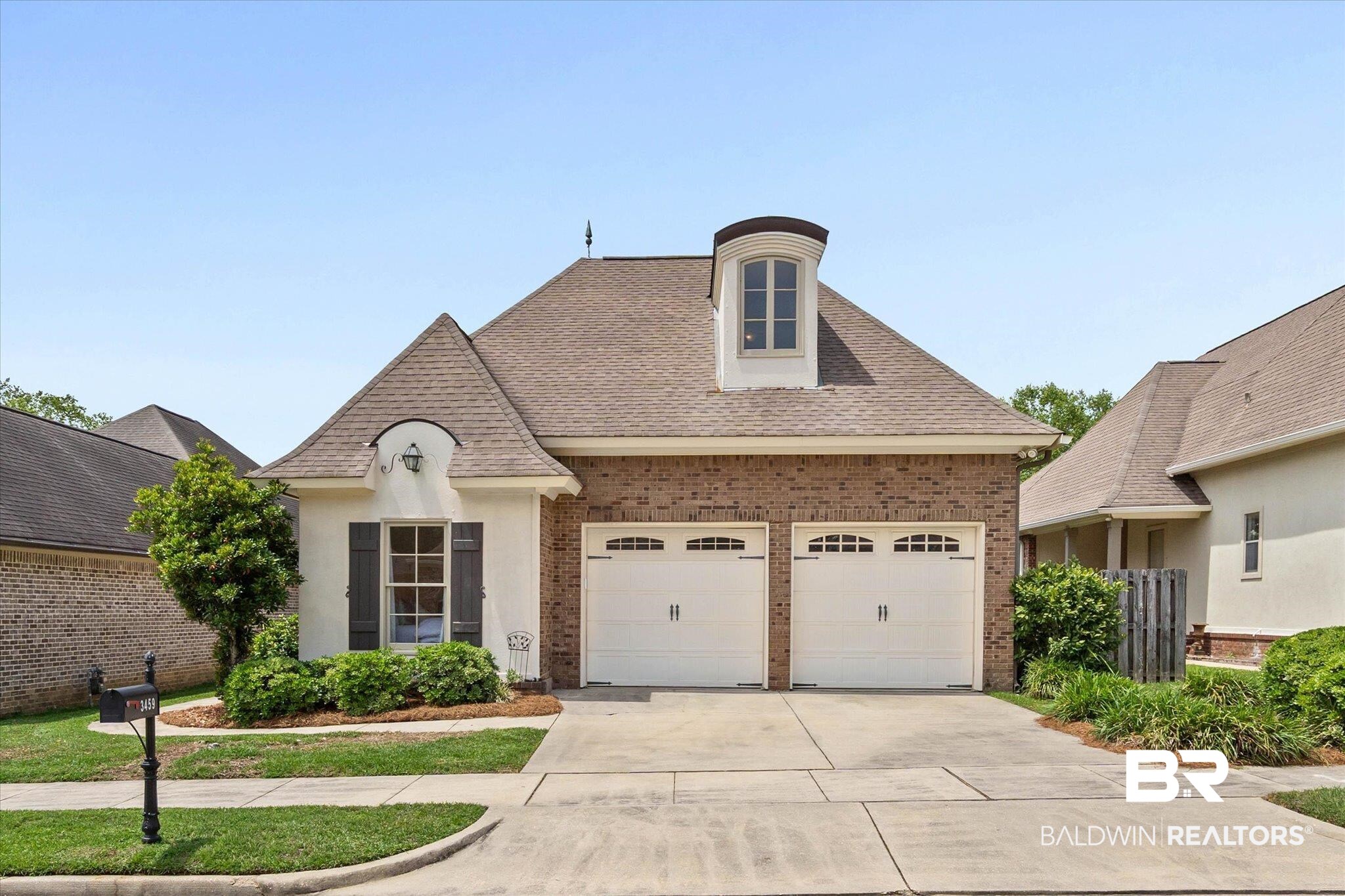 3459 Rue Royal Mobile, AL 36693 - Photo 31 of 31 Brick and stucco exterior with a prominent dormer and arched entryway