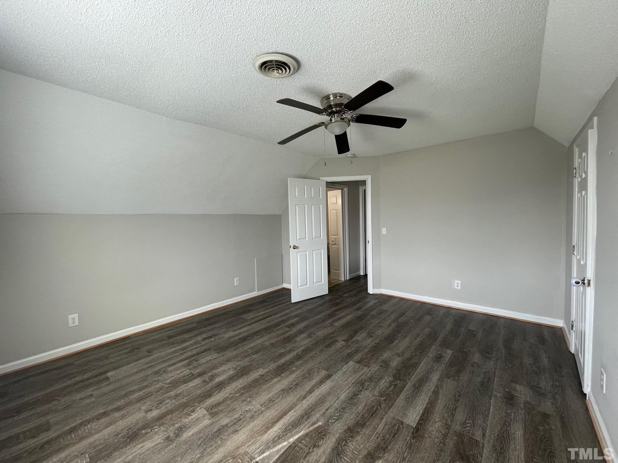 231 Smith Drive Angier, NC 27501 - Photo 14 of 19 a view of an empty room and wooden floor