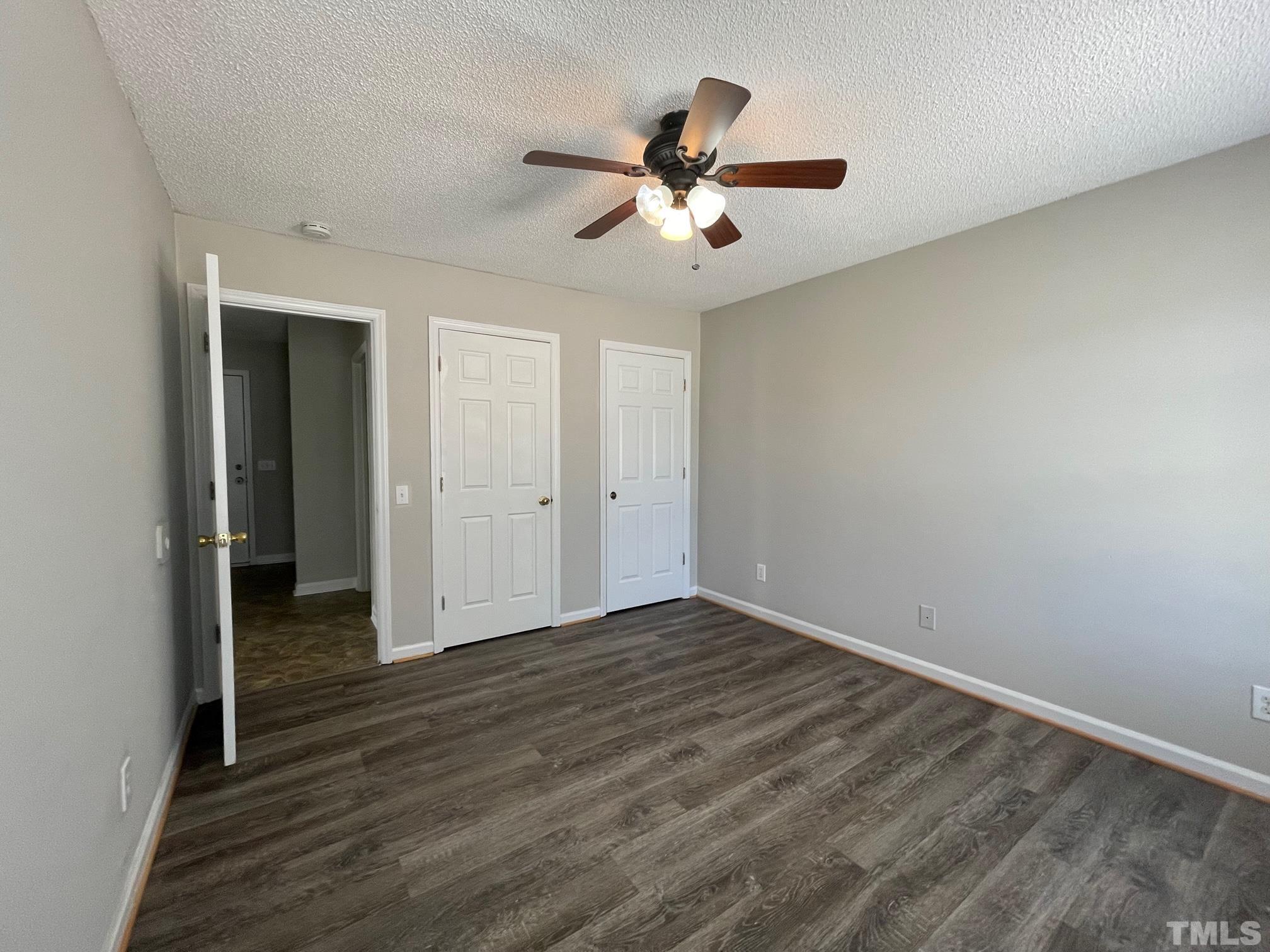 231 Smith Drive Angier, NC 27501 - Photo 9 of 19 a view of an empty room with wooden floor