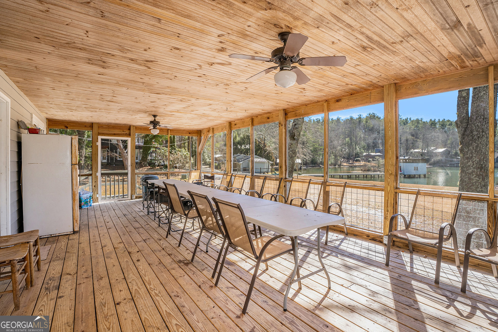 5622 Murray Cove Road Tiger, GA 30576 - Photo 21 of 39 a view of a dining room with furniture wooden floor and a chandelier