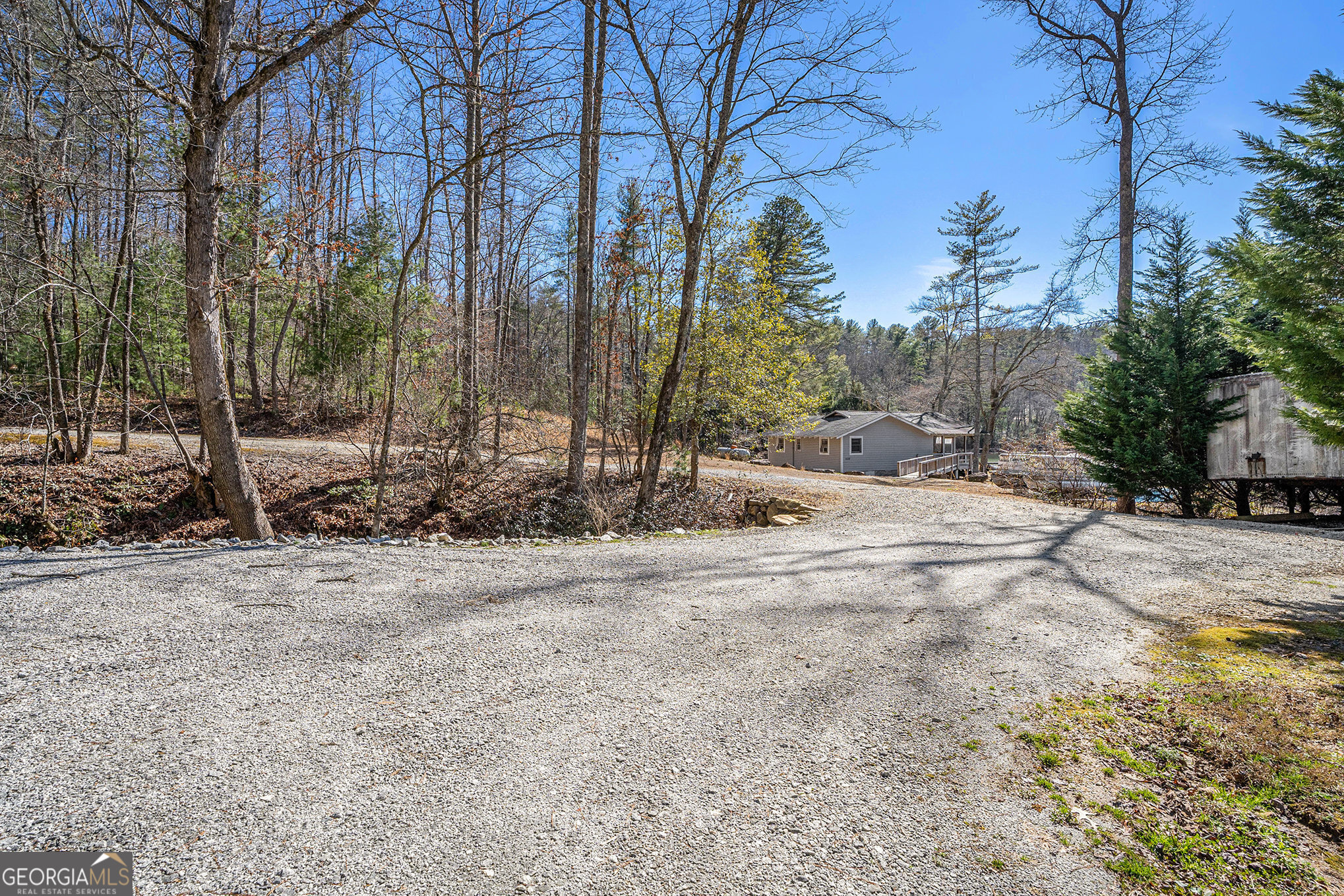 5622 Murray Cove Road Tiger, GA 30576 - Photo 39 of 39 a backyard of a house with trees and houses