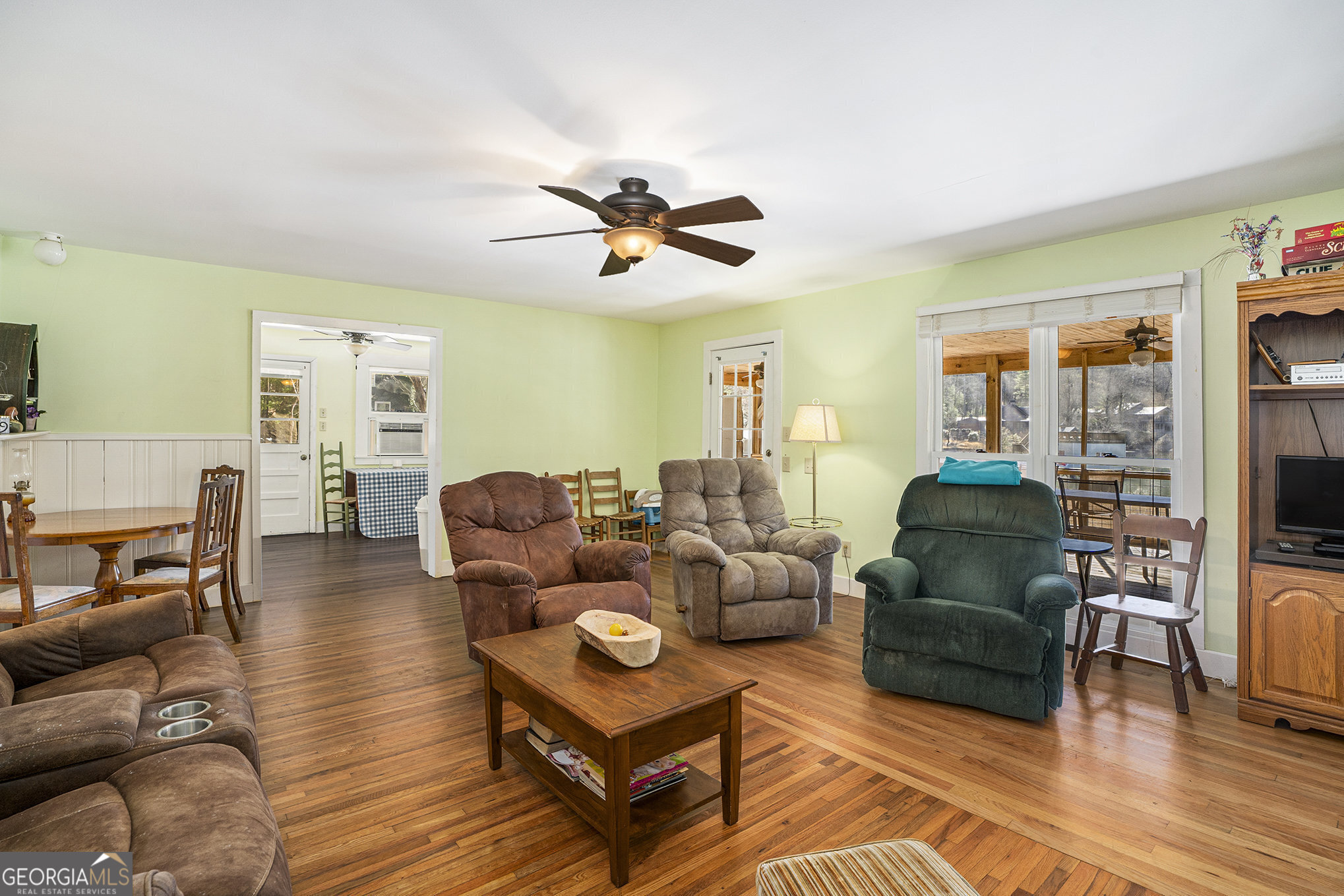 5622 Murray Cove Road Tiger, GA 30576 - Photo 5 of 39 a living room with furniture a flat screen tv and wooden floor