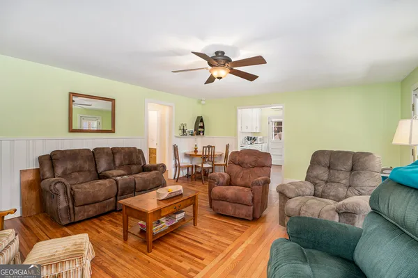a living room with furniture a bed and a couch