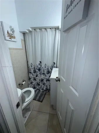 a bathroom with a sink and toilet