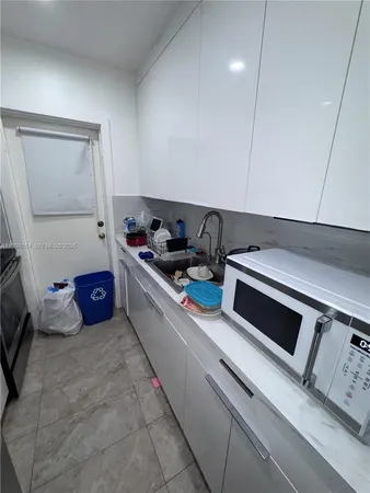 a kitchen with a stove and a cabinet