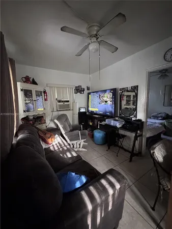 a kitchen with stainless steel appliances a stove a sink and a refrigerator