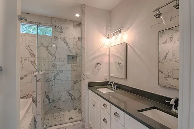 a bathroom with a bathtub and shower
