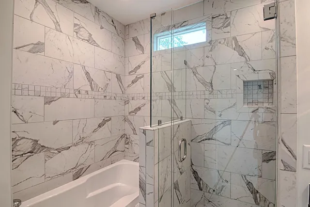 an empty room with wooden floor and window