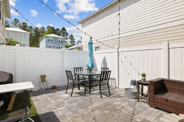 a bathroom with a window and a shower