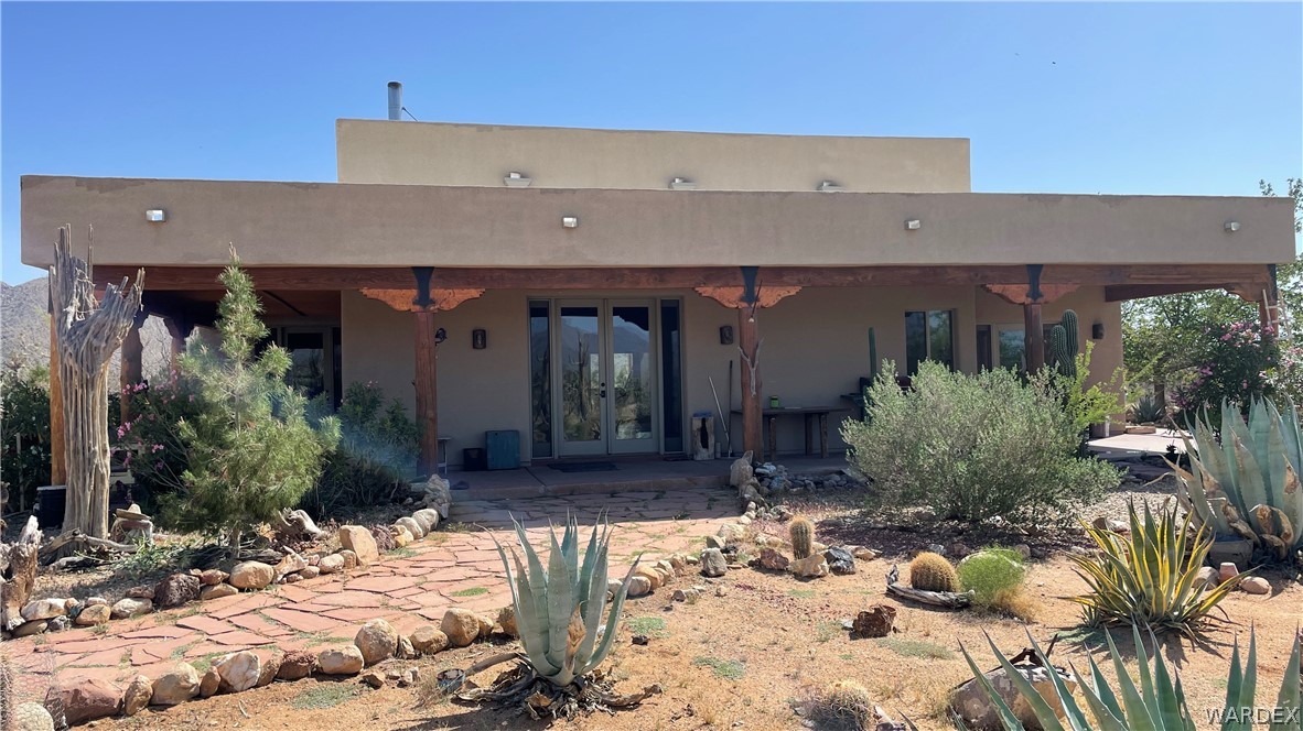 16250 South Tom Mix Road Yucca, AZ 86438 - Photo 1 of 1 a view of a house with yard and sitting area