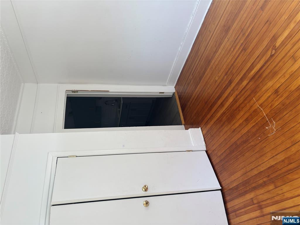 86 Center Street, Unit 2F Clifton, NJ 07011 - Photo 6 of 11 a view of empty room with wooden floor