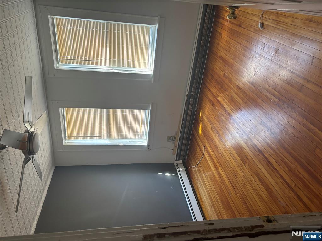86 Center Street, Unit 2F Clifton, NJ 07011 - Photo 7 of 11 a view of a room with wooden floor and windows