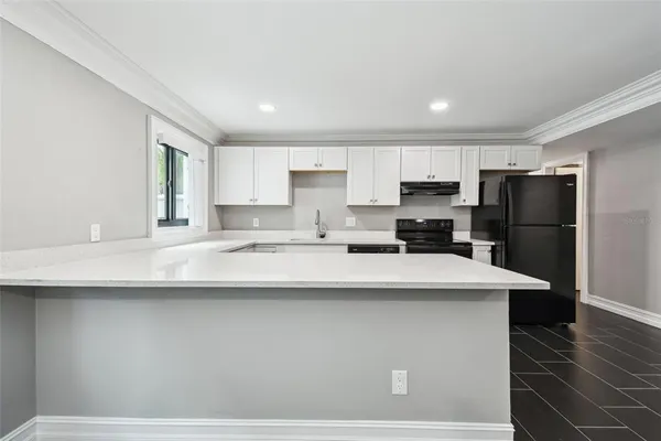 a kitchen with a sink and cabinets