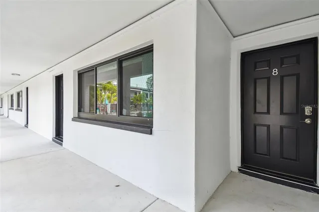 a bathroom with a granite countertop sink and a toilet